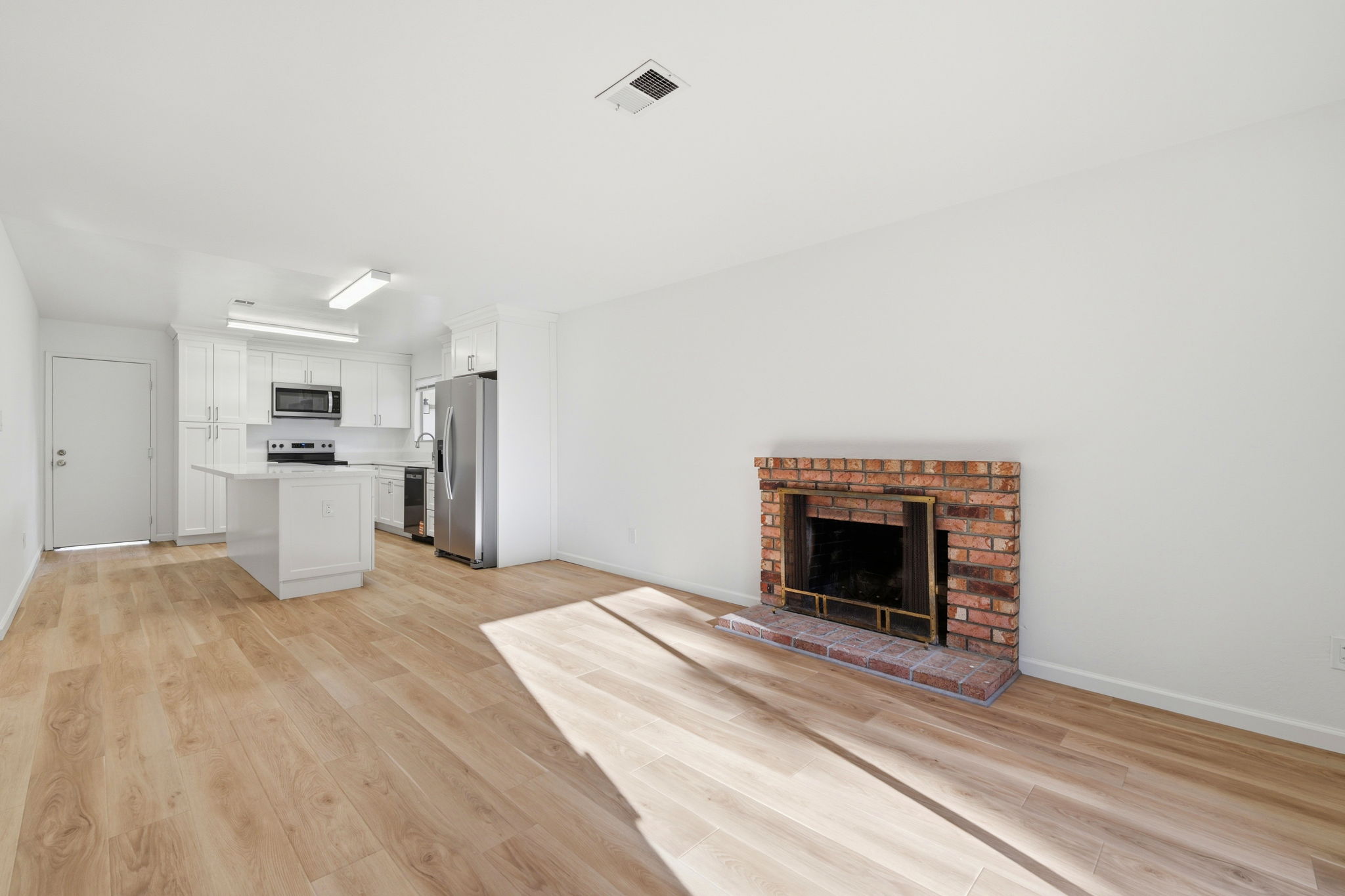 Living room opening to the rebuilt kitchen in a Walnut Creek ranch home.