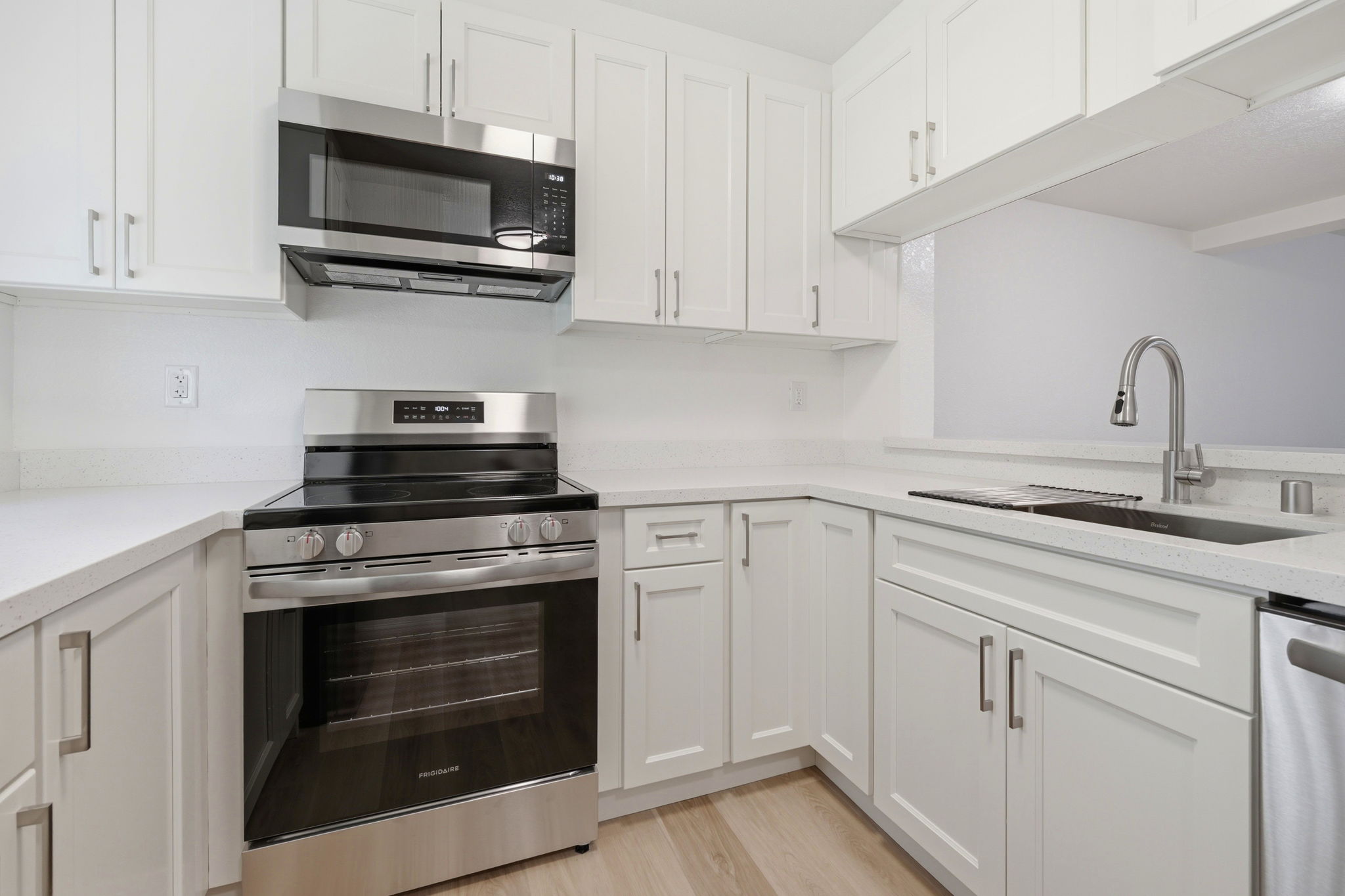 New kitchen with quartz counters in a Martinez townhouse.